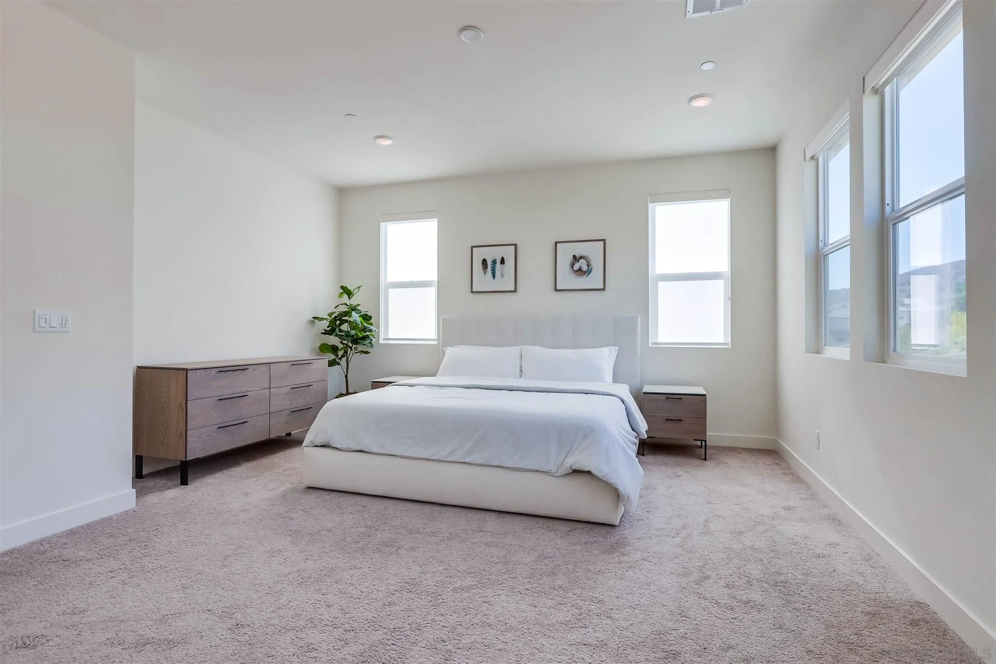 8922 Trailridge Avenue Santee, CA 92071 - Photo 17 of 31 a spacious bedroom with a bed and a potted plant