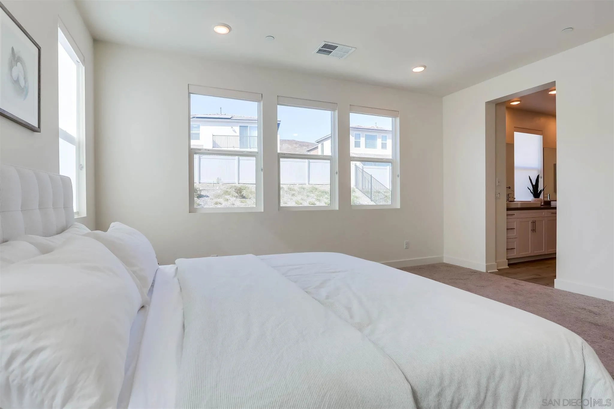 8922 Trailridge Avenue Santee, CA 92071 - Photo 18 of 31 a bedroom with a bed and a large window