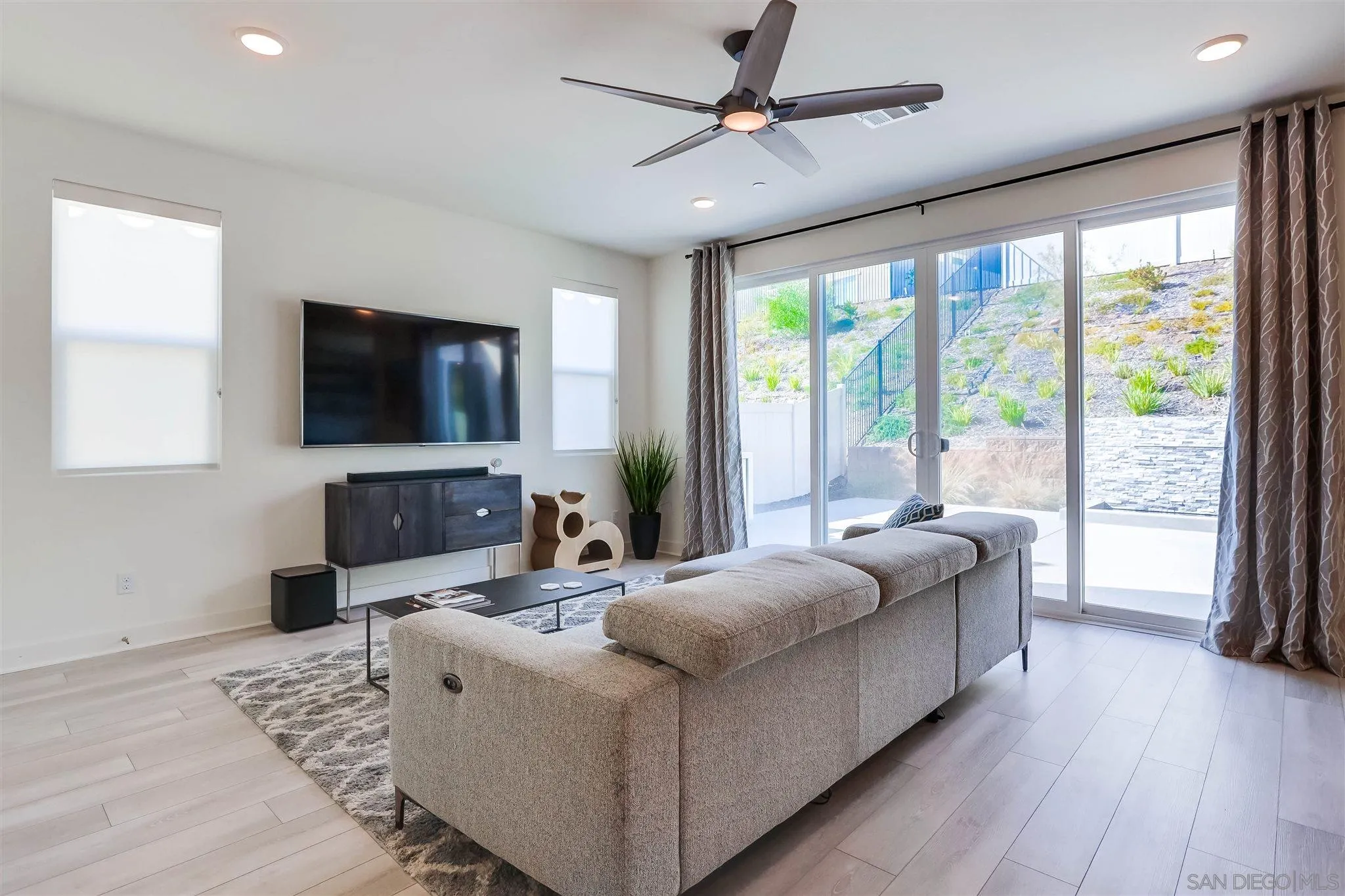 8922 Trailridge Avenue Santee, CA 92071 - Photo 5 of 31 a living room with furniture and a flat screen tv