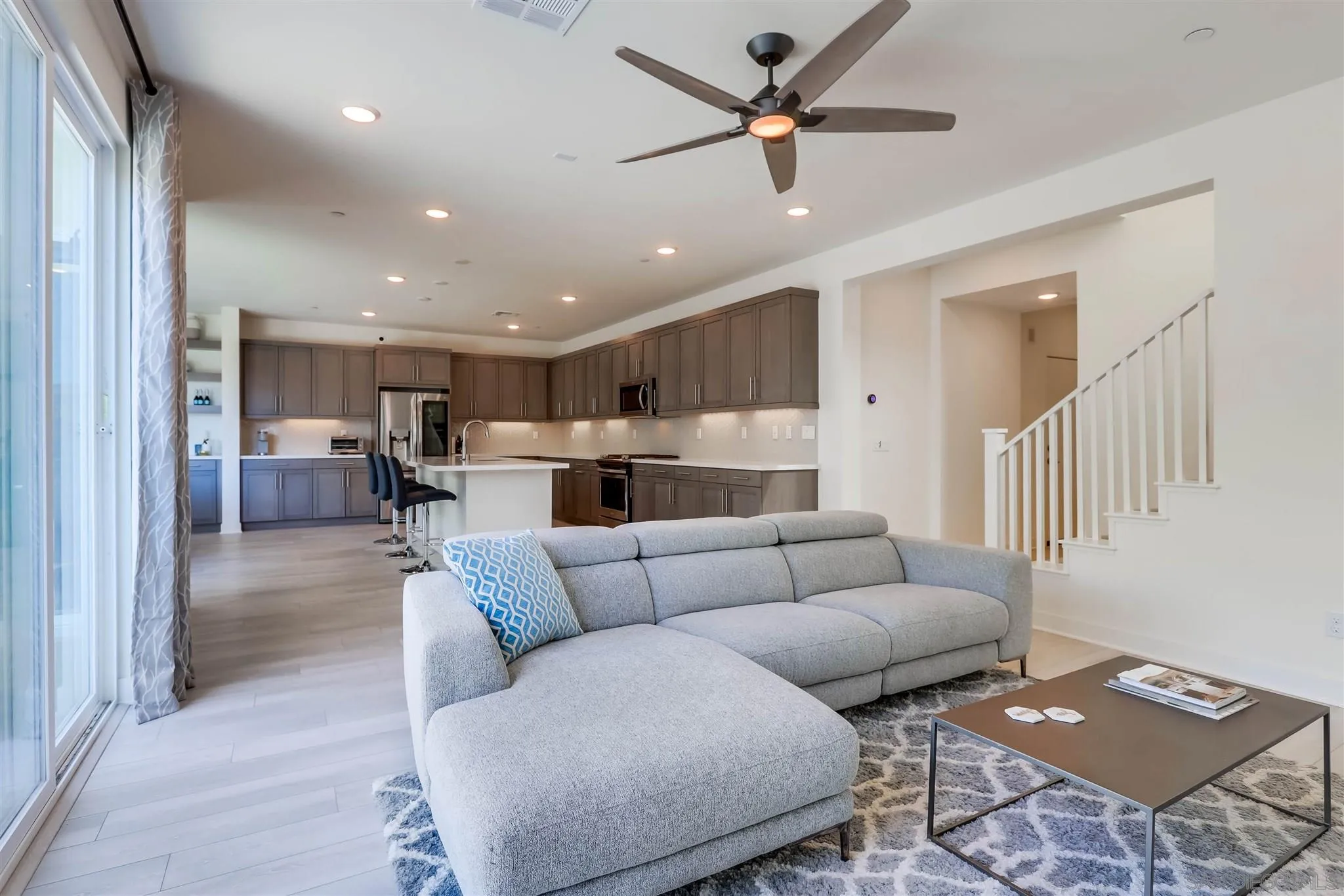 8922 Trailridge Avenue Santee, CA 92071 - Photo 7 of 31 a living room with furniture and kitchen view