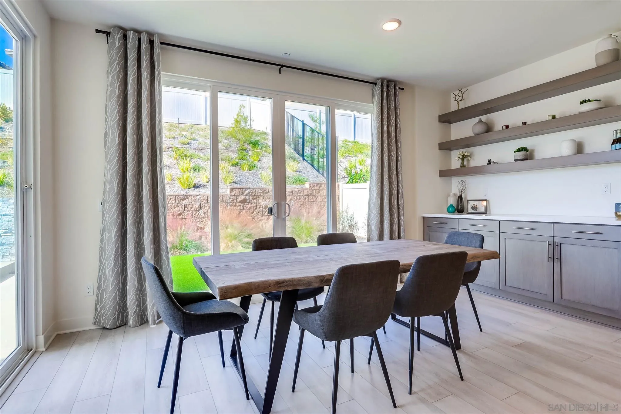 8922 Trailridge Avenue Santee, CA 92071 - Photo 10 of 31 a view of a dining room with furniture and a window