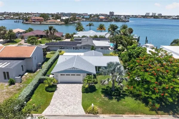 an aerial view of a house with yard lake and lake view