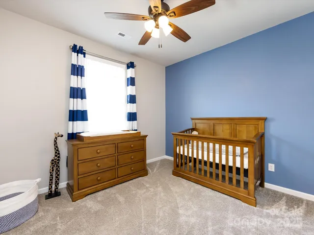 a view of a room with a window and stairs