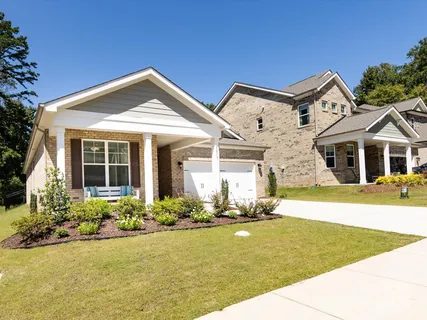 a front view of a house with a yard outdoor seating