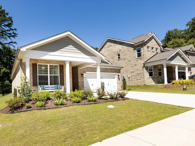 a front view of a house with a yard outdoor seating