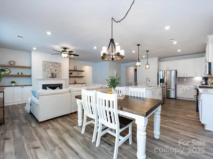 a bedroom with a bed and a potted plant