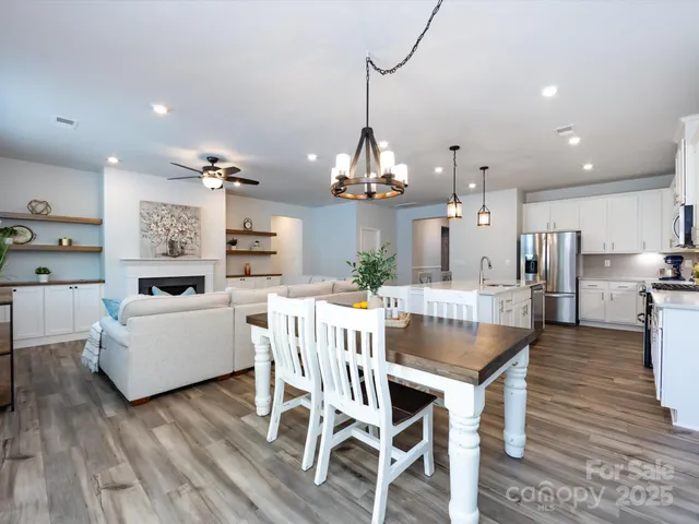 a bedroom with a bed and a potted plant