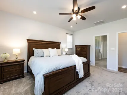 a bathroom with a granite countertop sink double and mirror