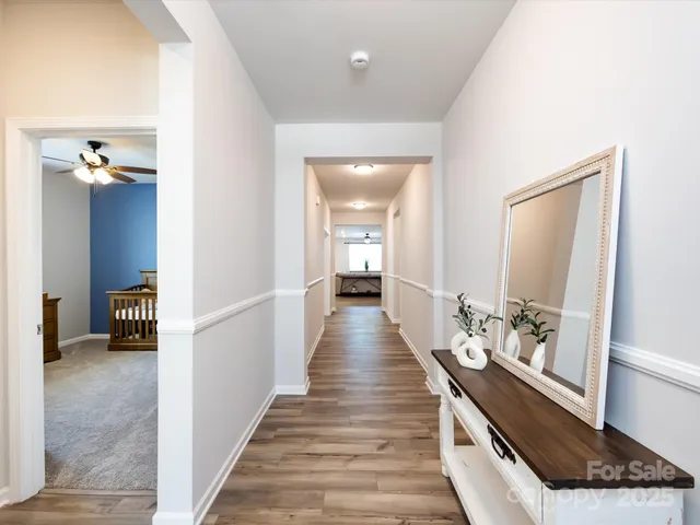 a large bed sitting in a bedroom next to a window