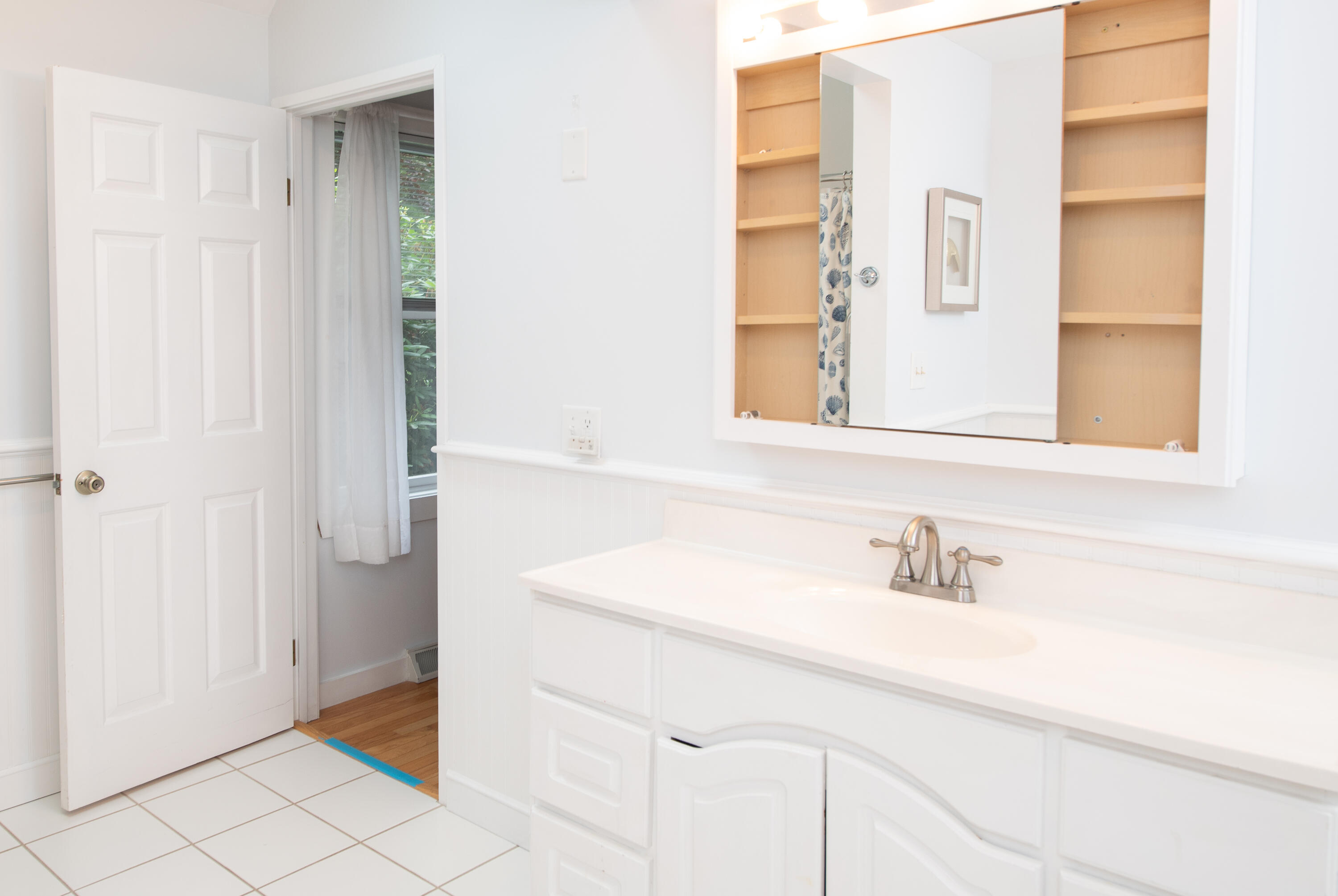 1 Shellback Way, Unit A1 Mashpee, MA 02649 - Photo 20 of 42 a bathroom with a sink and a mirror