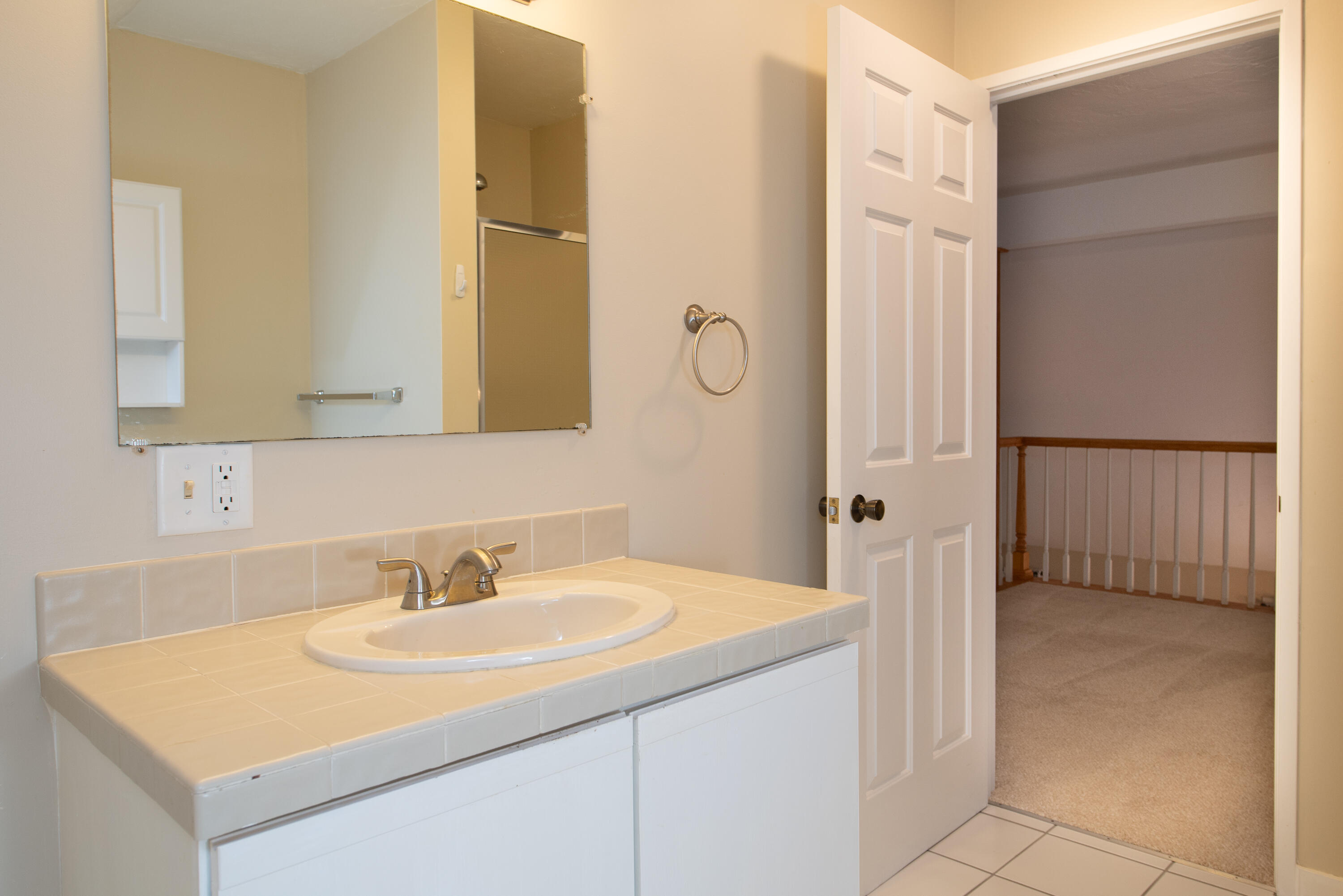 1 Shellback Way, Unit A1 Mashpee, MA 02649 - Photo 32 of 42 a bathroom with a sink and a mirror
