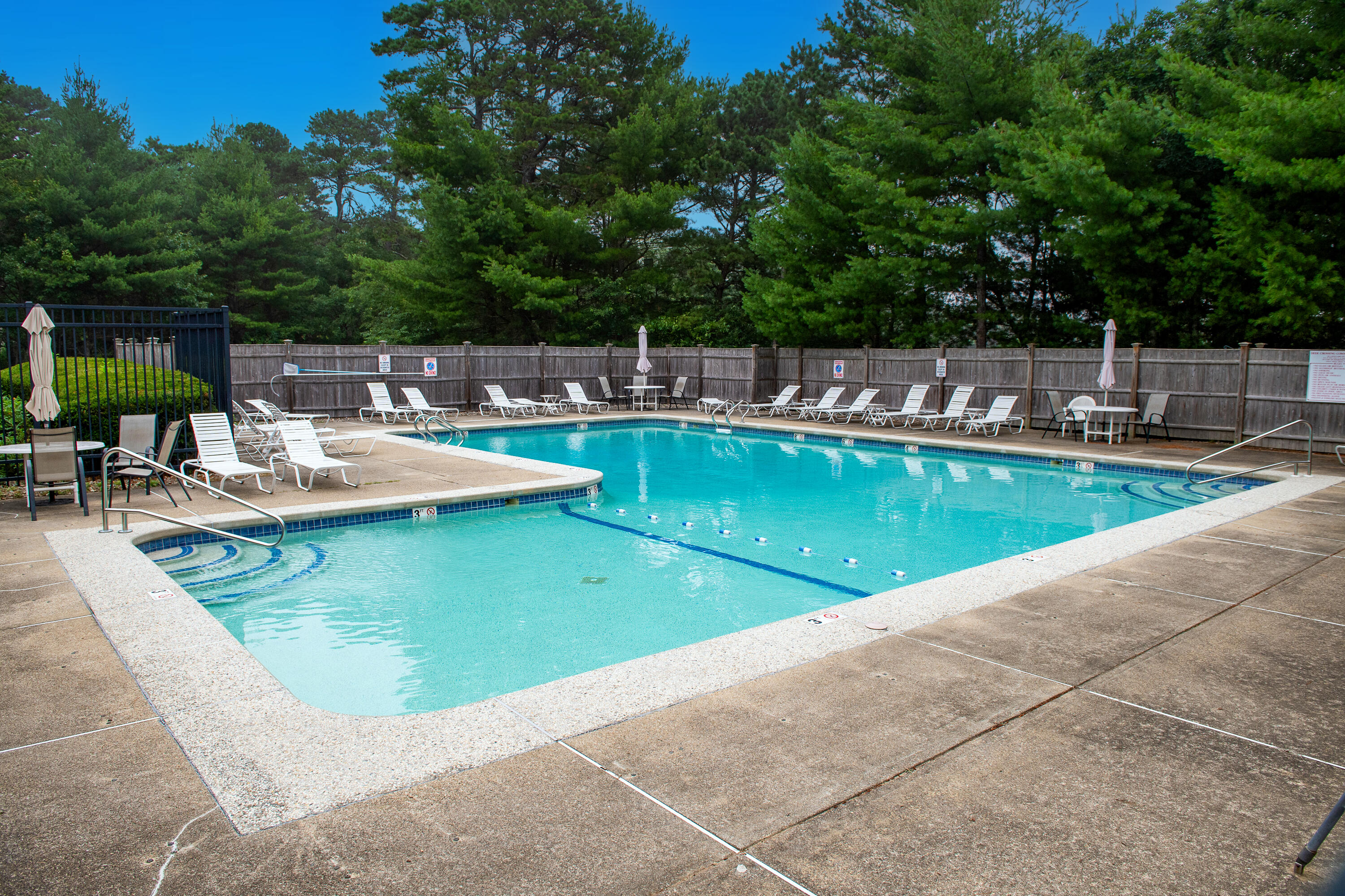 1 Shellback Way, Unit A1 Mashpee, MA 02649 - Photo 41 of 42 a view of a swimming pool with chairs