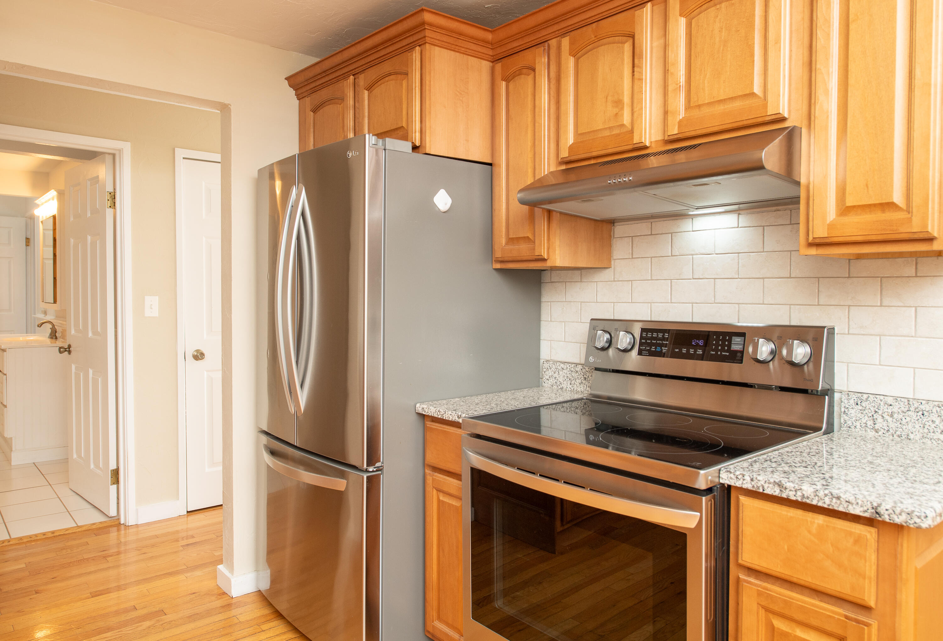 1 Shellback Way, Unit A1 Mashpee, MA 02649 - Photo 5 of 42 a kitchen with a stove and a refrigerator