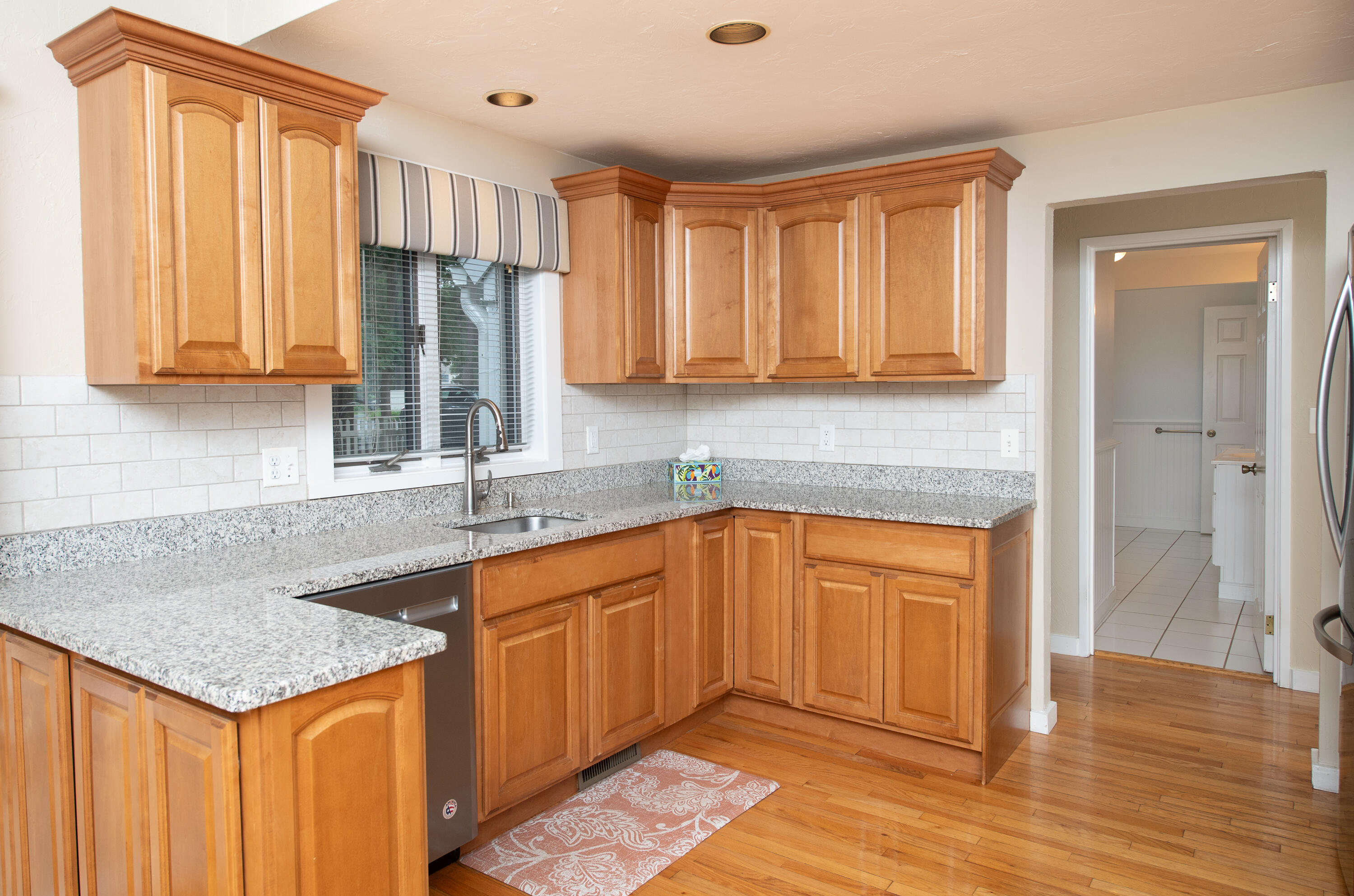 1 Shellback Way, Unit A1 Mashpee, MA 02649 - Photo 6 of 42 a kitchen with stainless steel appliances granite countertop a sink stove and cabinets