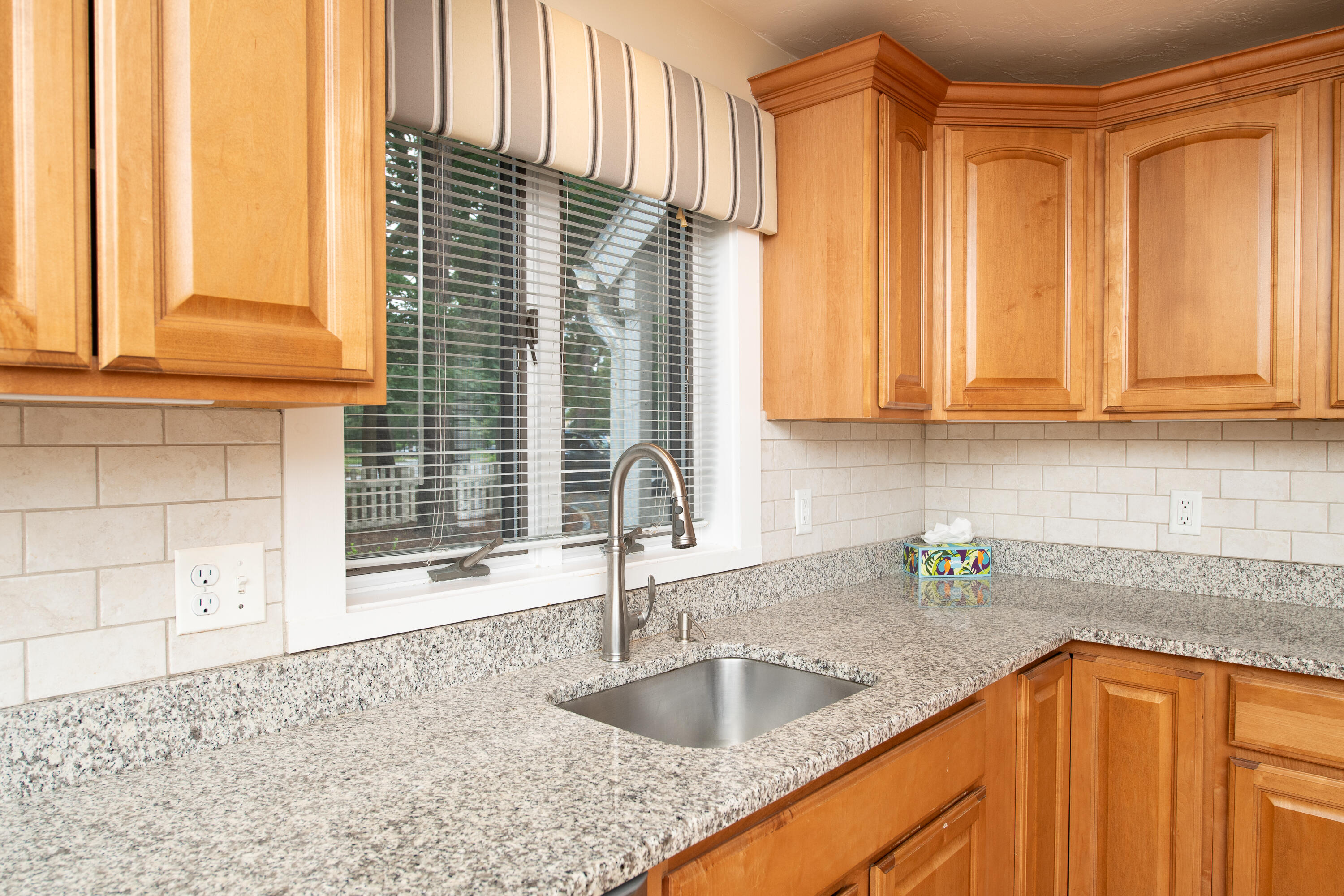 1 Shellback Way, Unit A1 Mashpee, MA 02649 - Photo 7 of 42 a kitchen with granite countertop a sink and a window
