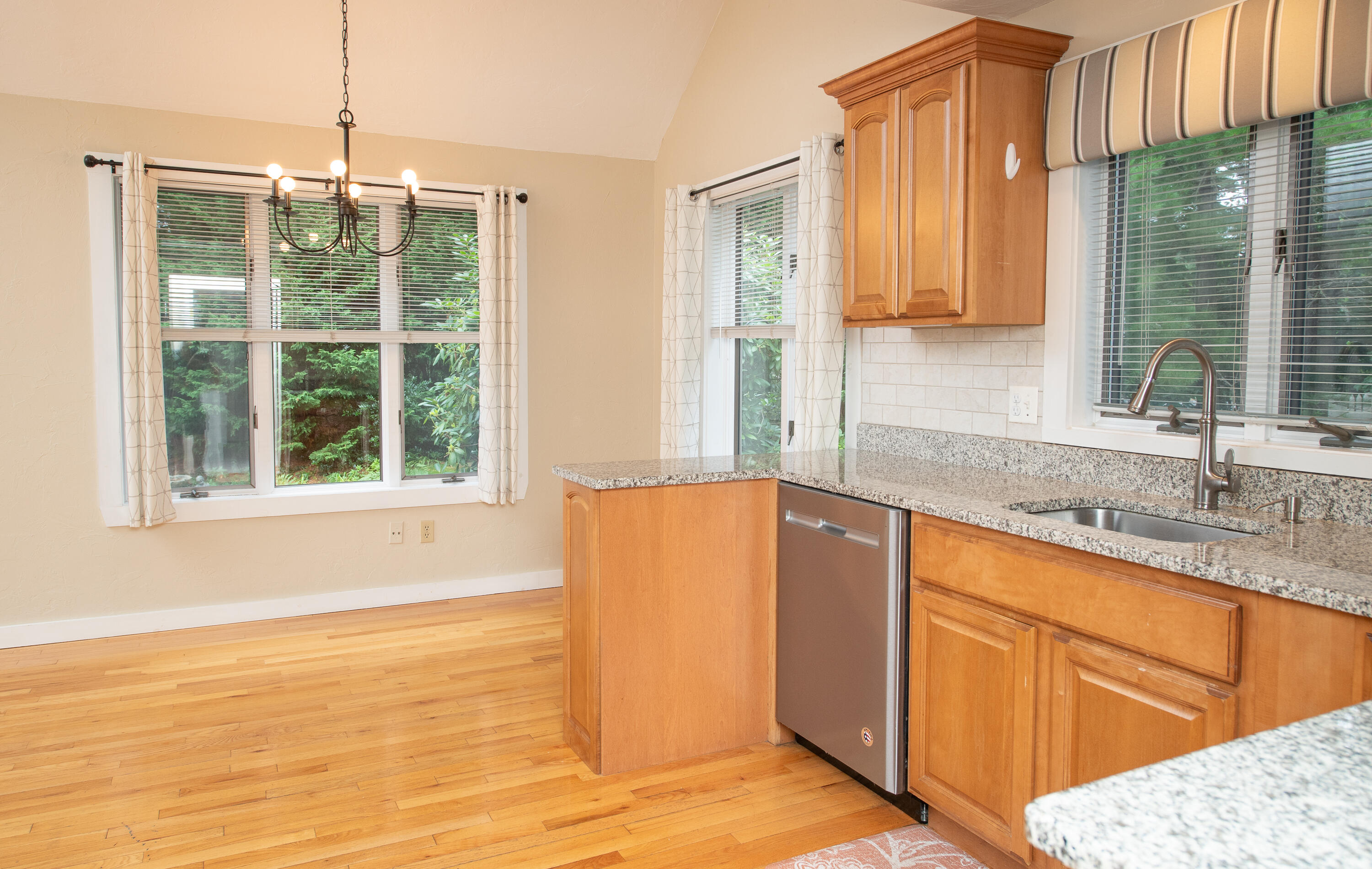 1 Shellback Way, Unit A1 Mashpee, MA 02649 - Photo 10 of 42 a kitchen with stainless steel appliances granite countertop a sink a granite counter tops and a window