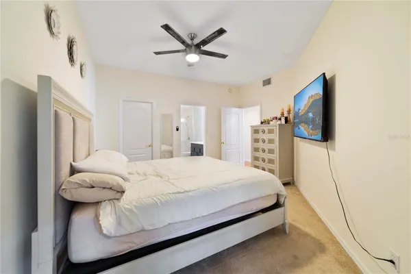 a bathroom with a sink vanity granite toilet and a mirror
