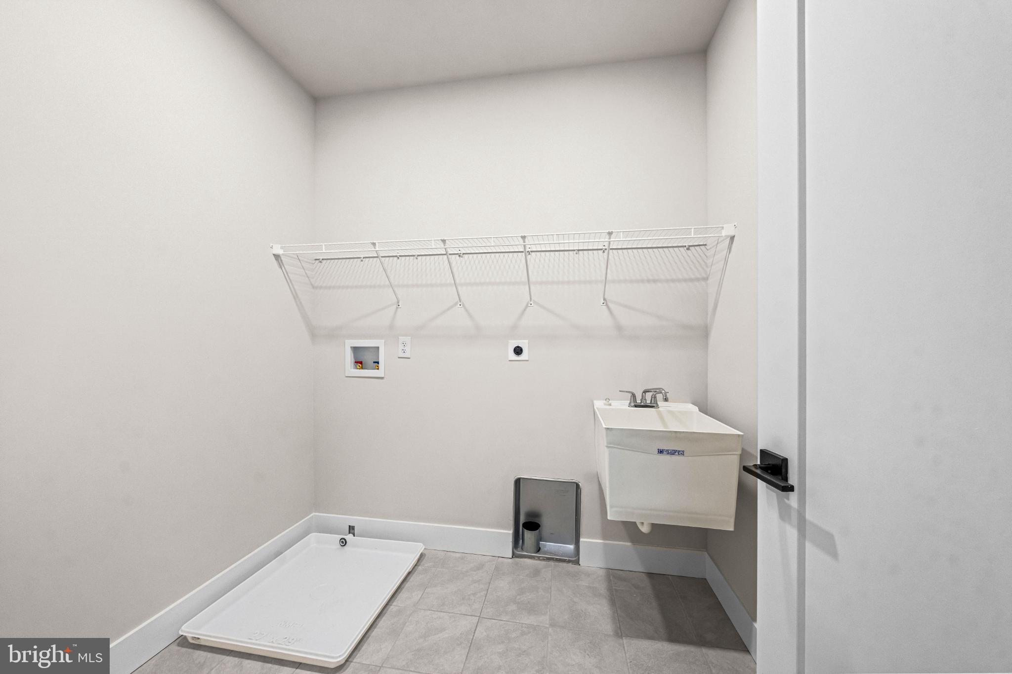 133 Alroy Road Malvern, PA 19355 - Photo 22 of 48 Spacious laundry area with utility sink.