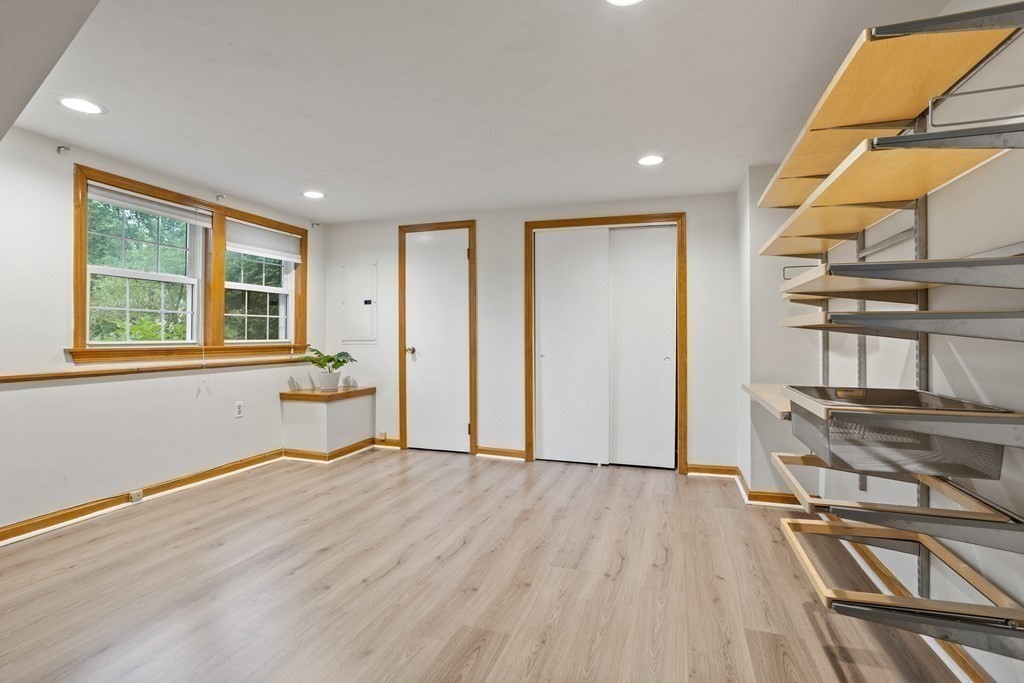 26 Alta Road Sudbury, MA 01776 - Photo 25 of 37 a view of an empty room with a window and wooden floor