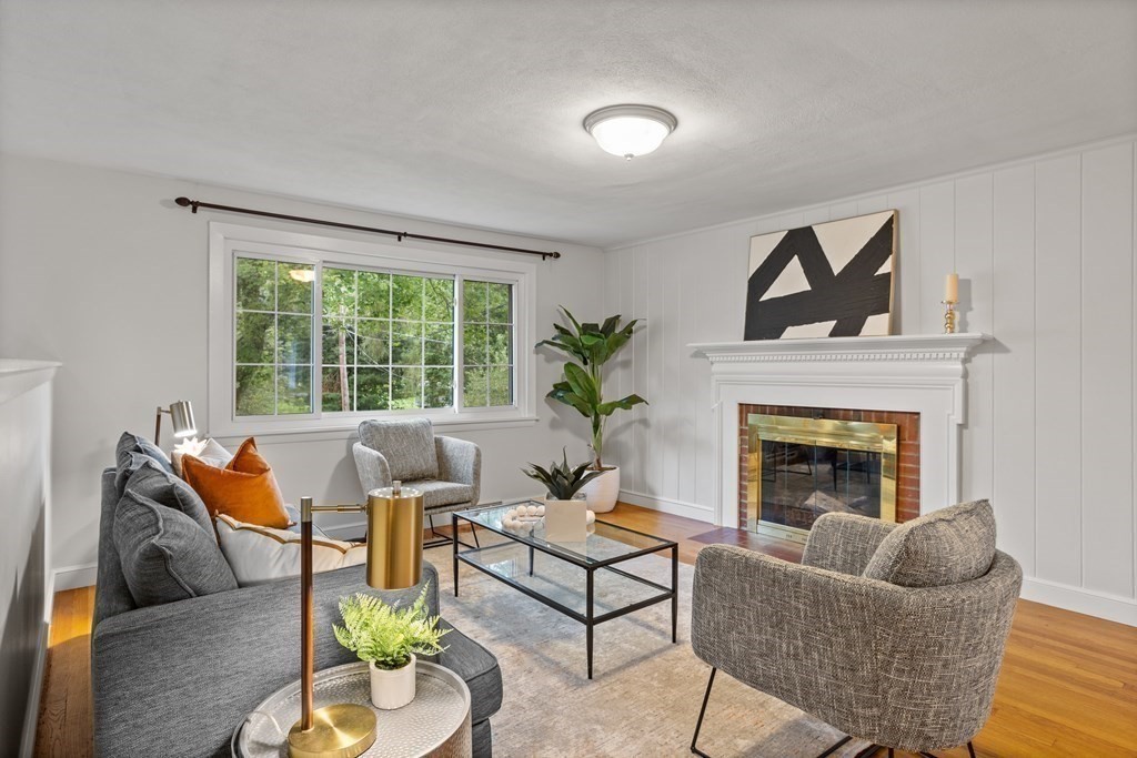 26 Alta Road Sudbury, MA 01776 - Photo 10 of 37 a living room with furniture and a fireplace
