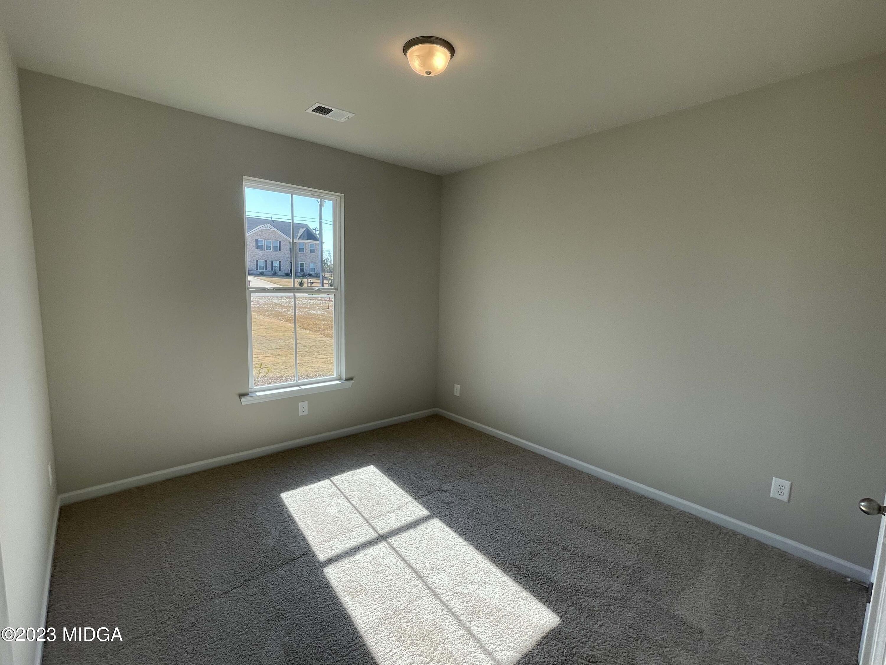 159 Sanders Road Macon, GA 31210 - Photo 19 of 40 an empty room with a window