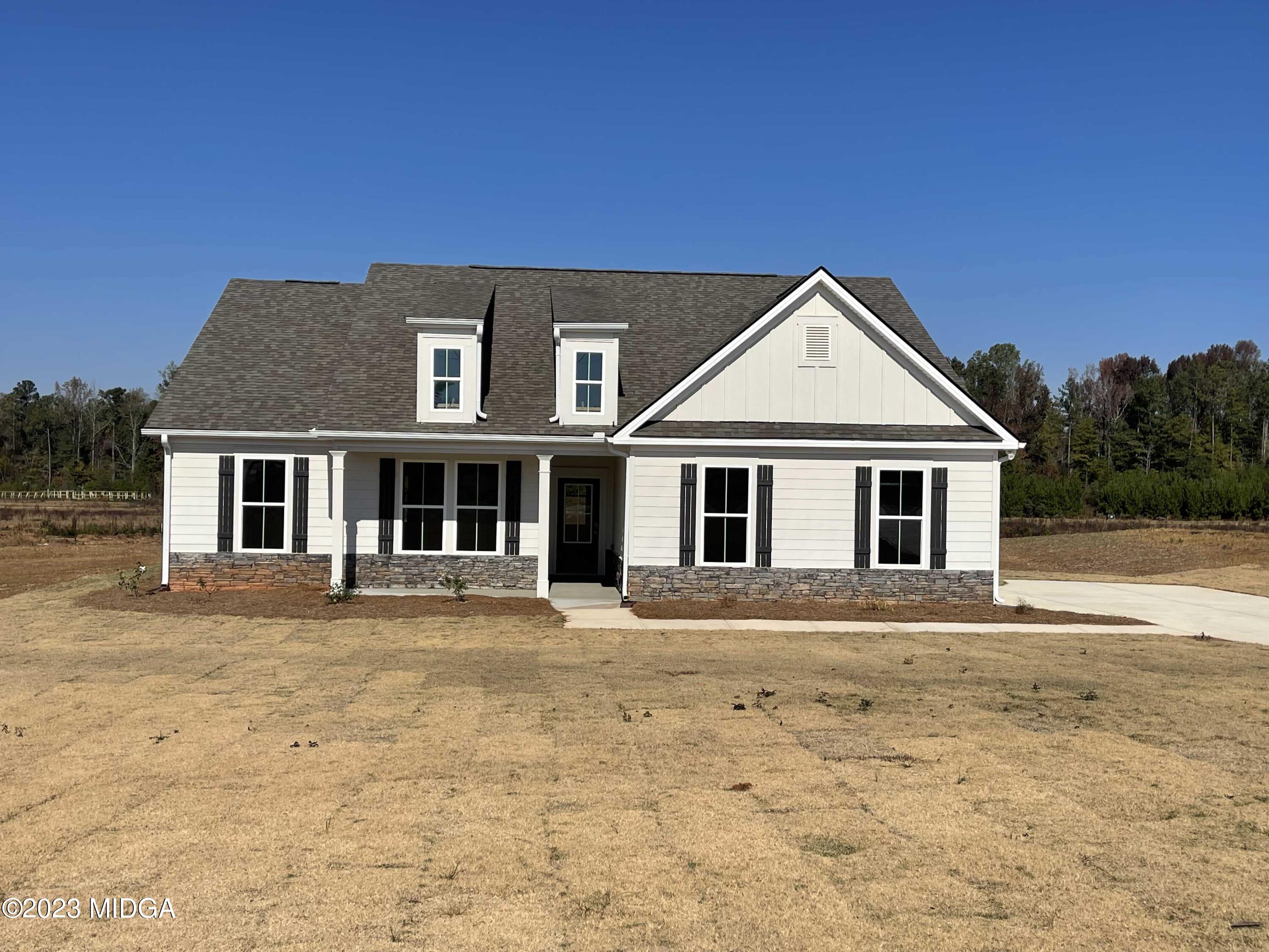 159 Sanders Road Macon, GA 31210 - Photo 2 of 40 a front view of a house with a yard