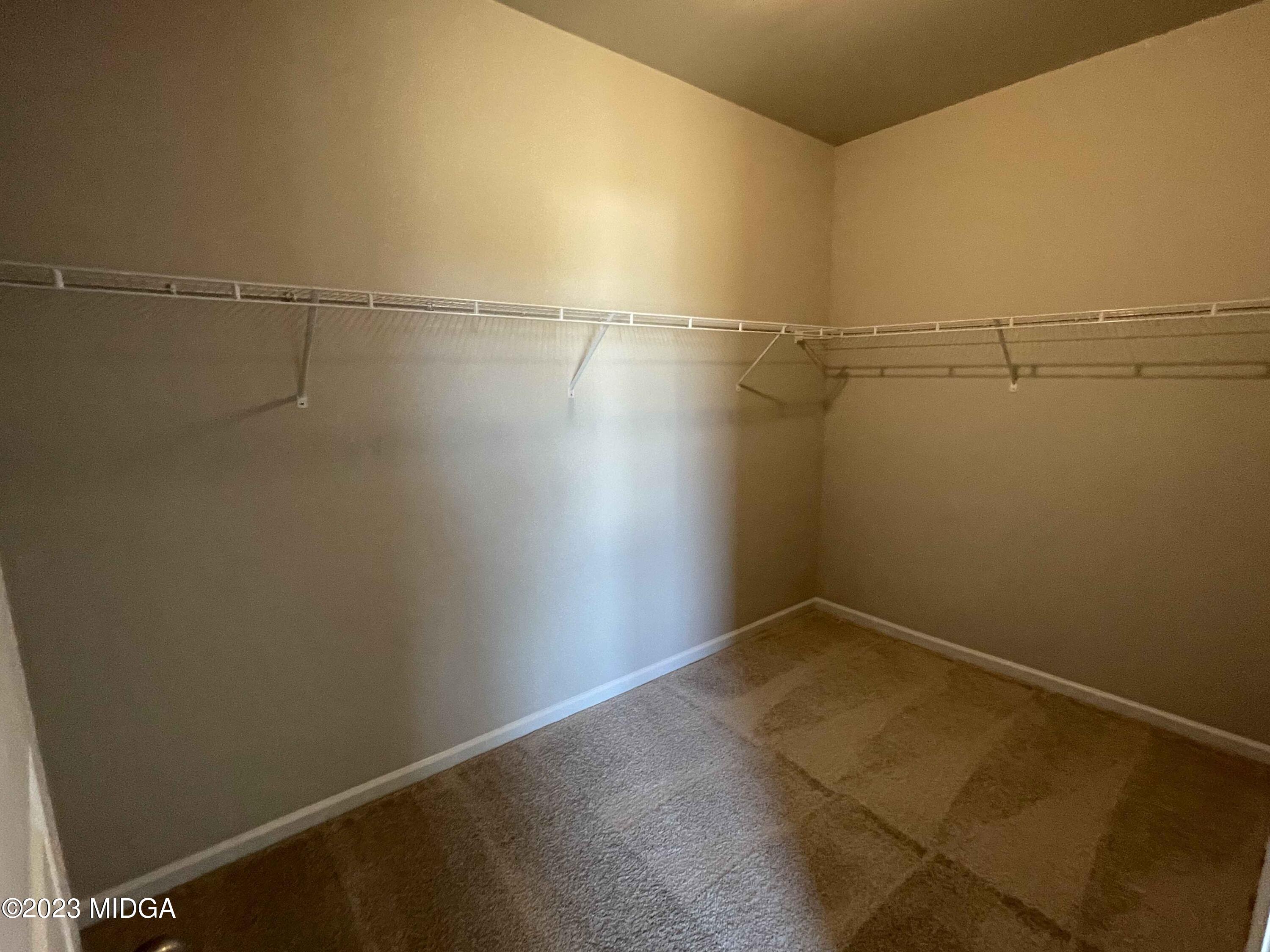 159 Sanders Road Macon, GA 31210 - Photo 29 of 40 a view of a room with racks on the wall
