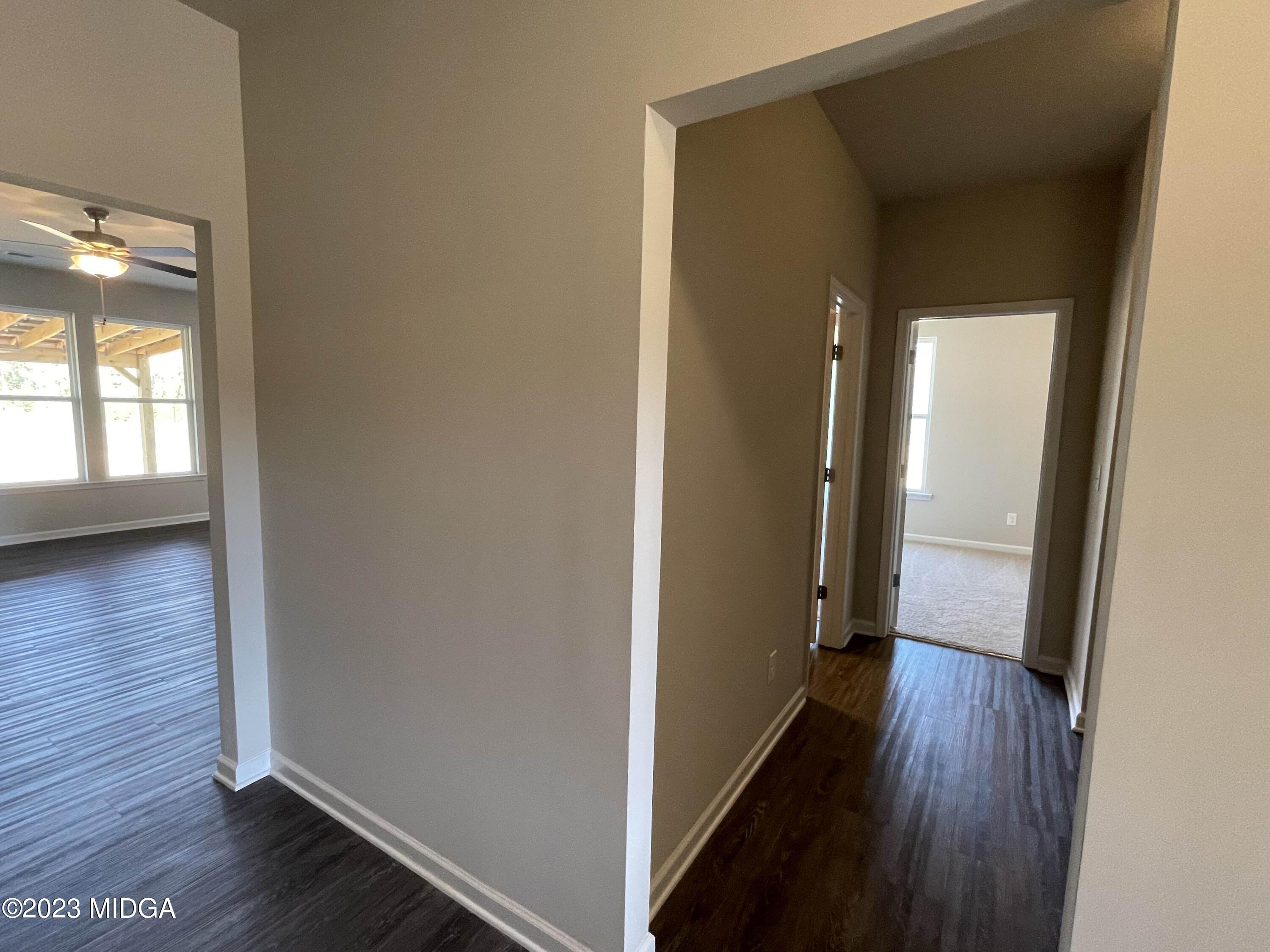 159 Sanders Road Macon, GA 31210 - Photo 6 of 40 a view of a hallway with wooden floor