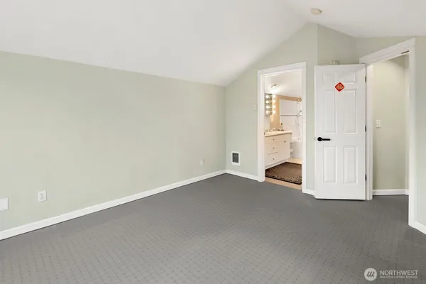 an empty room with windows and yard