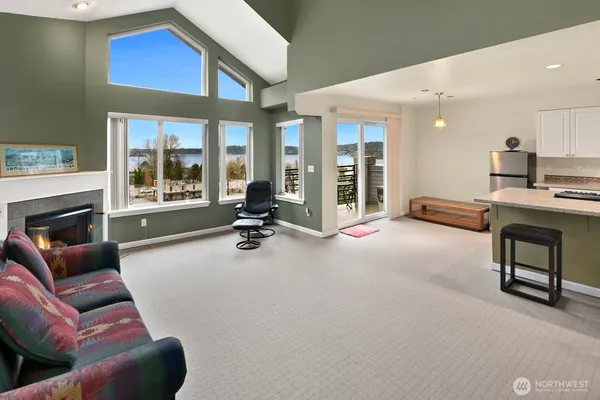 a view of a livingroom with furniture and a fireplace