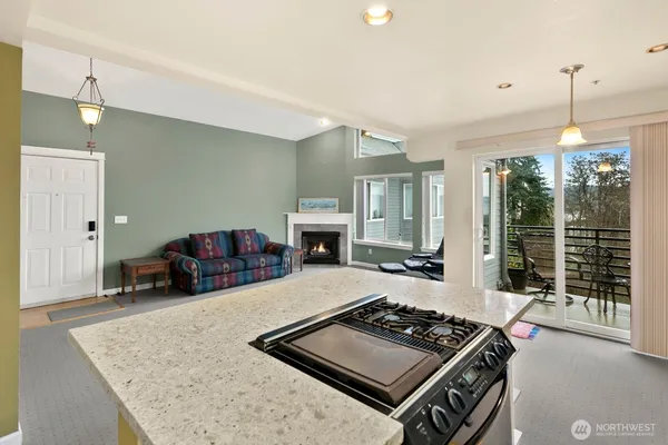 a room with pool table and a large window
