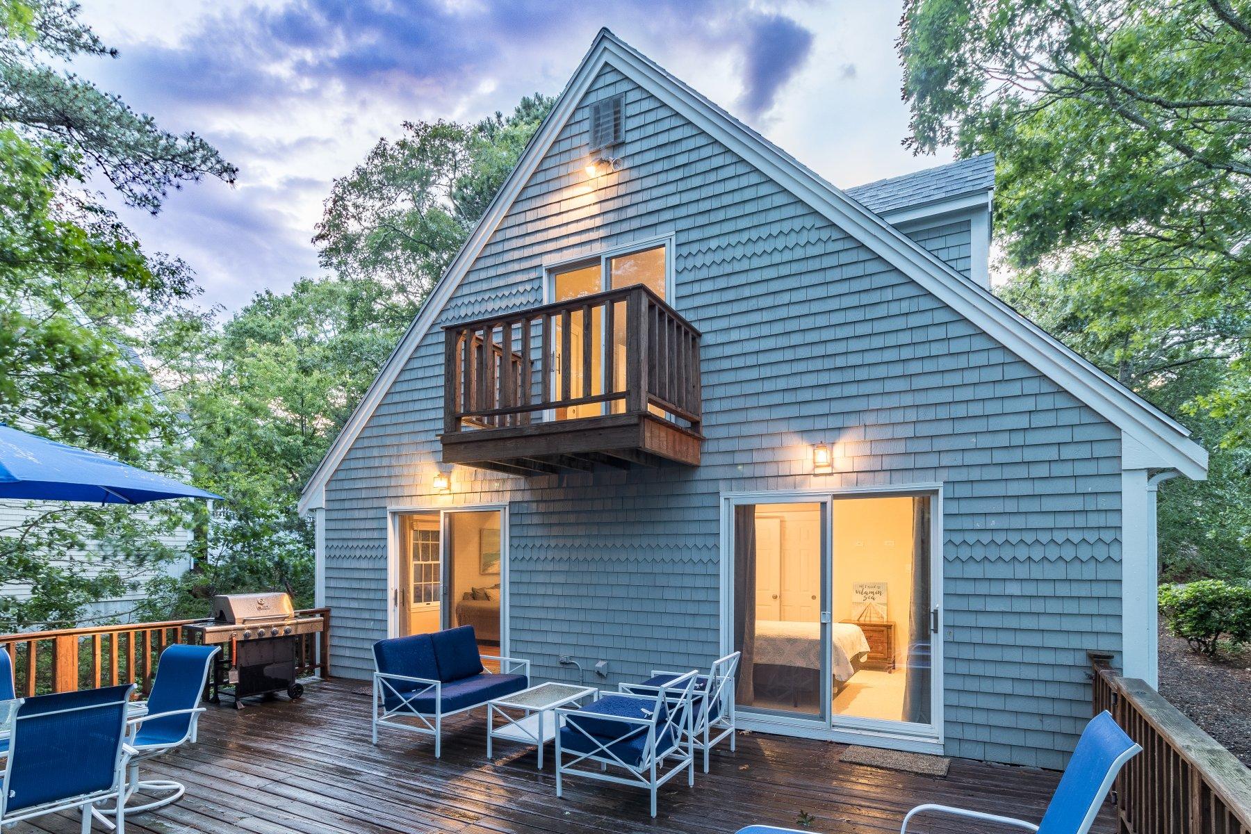 22 Quaker Run Road Mashpee, MA 02649 - Photo 6 of 34 a backyard of a house with seating space