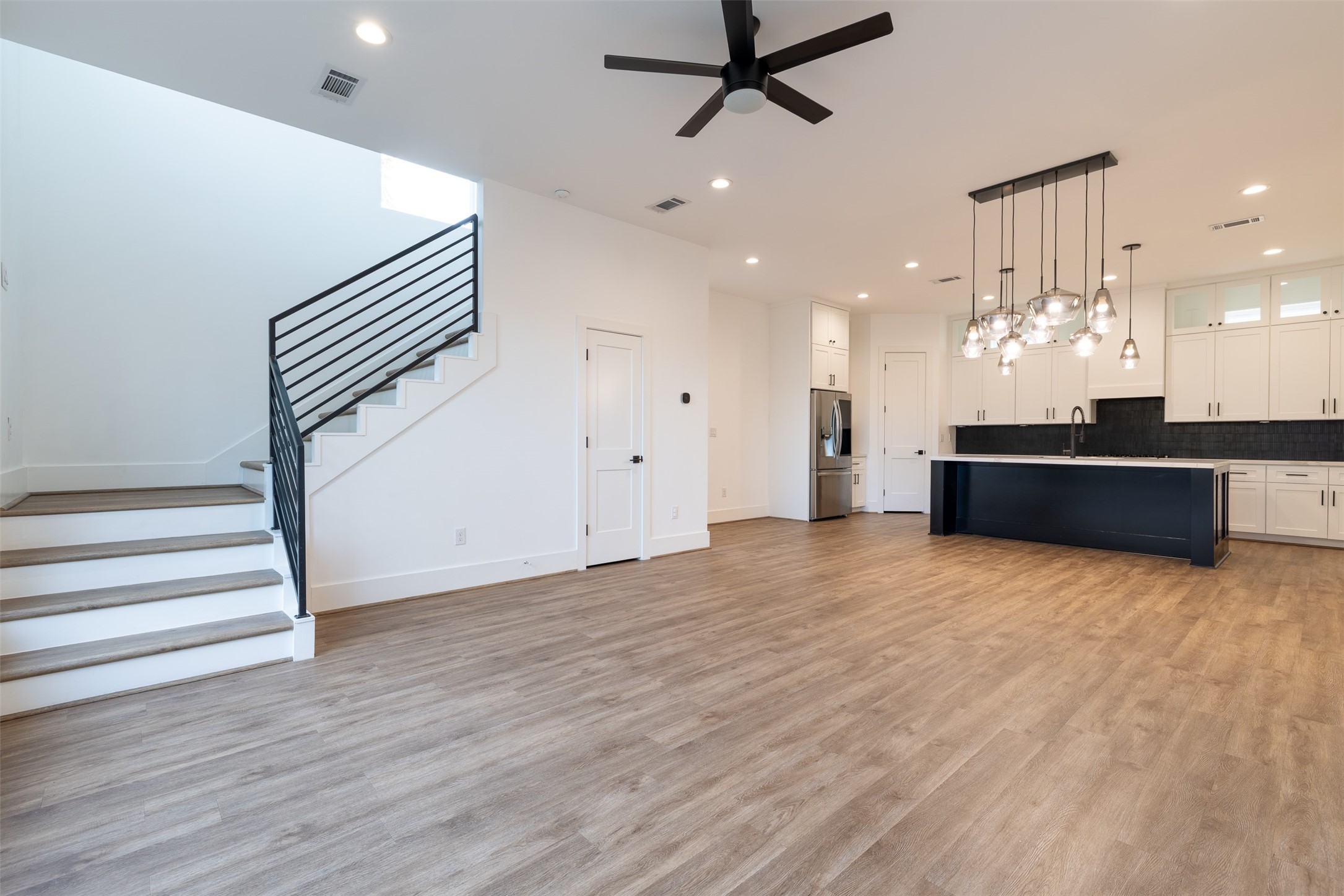 1206 Hamblen Street Houston, TX 77009 - Photo 15 of 33 Large open concept living area and kitchen! Half bath found behind door under stairs.