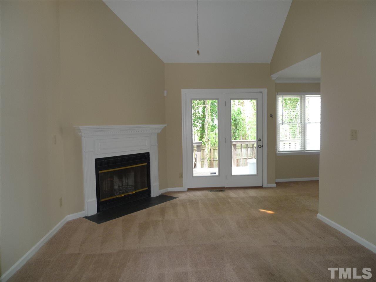 1004 Oak Lake Court Raleigh, NC 27606 - Photo 2 of 9 a view of empty room with a fireplace