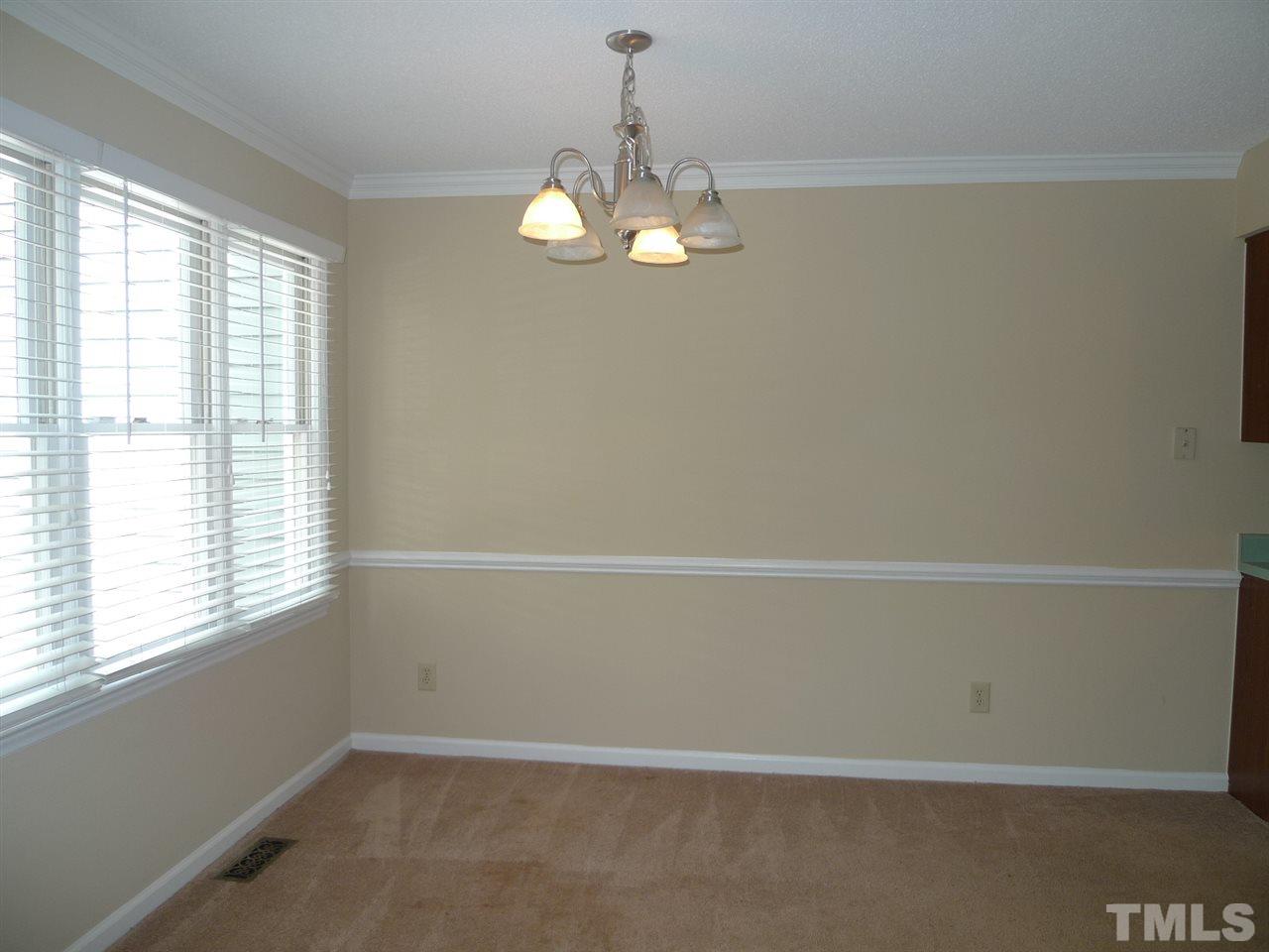 1004 Oak Lake Court Raleigh, NC 27606 - Photo 3 of 9 a view of an empty room with a window