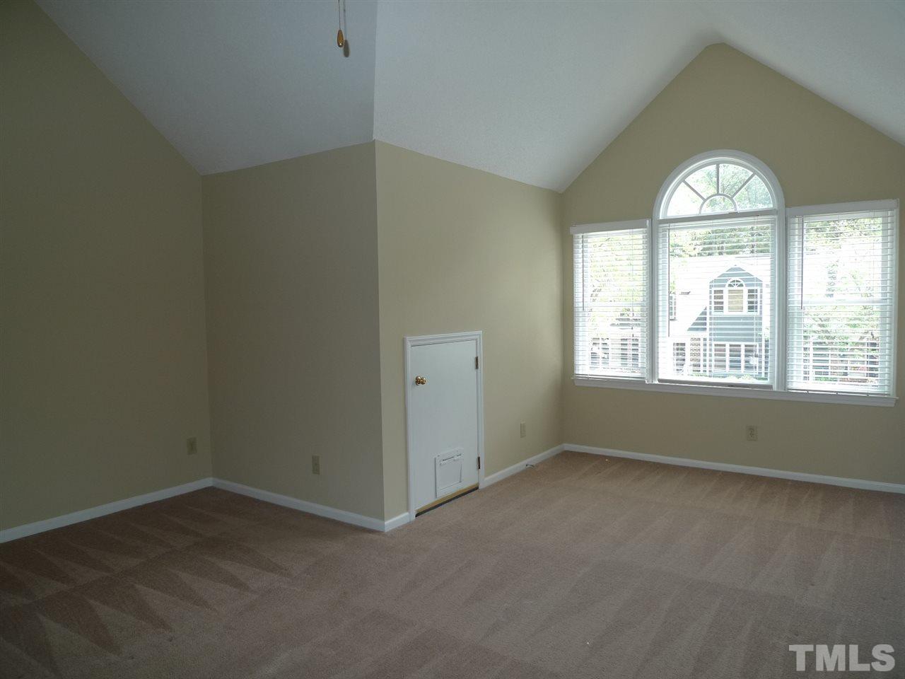 1004 Oak Lake Court Raleigh, NC 27606 - Photo 5 of 9 an empty room with a window