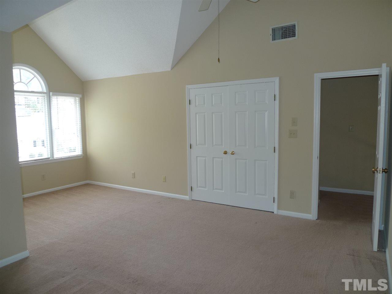 1004 Oak Lake Court Raleigh, NC 27606 - Photo 6 of 9 an empty room with windows