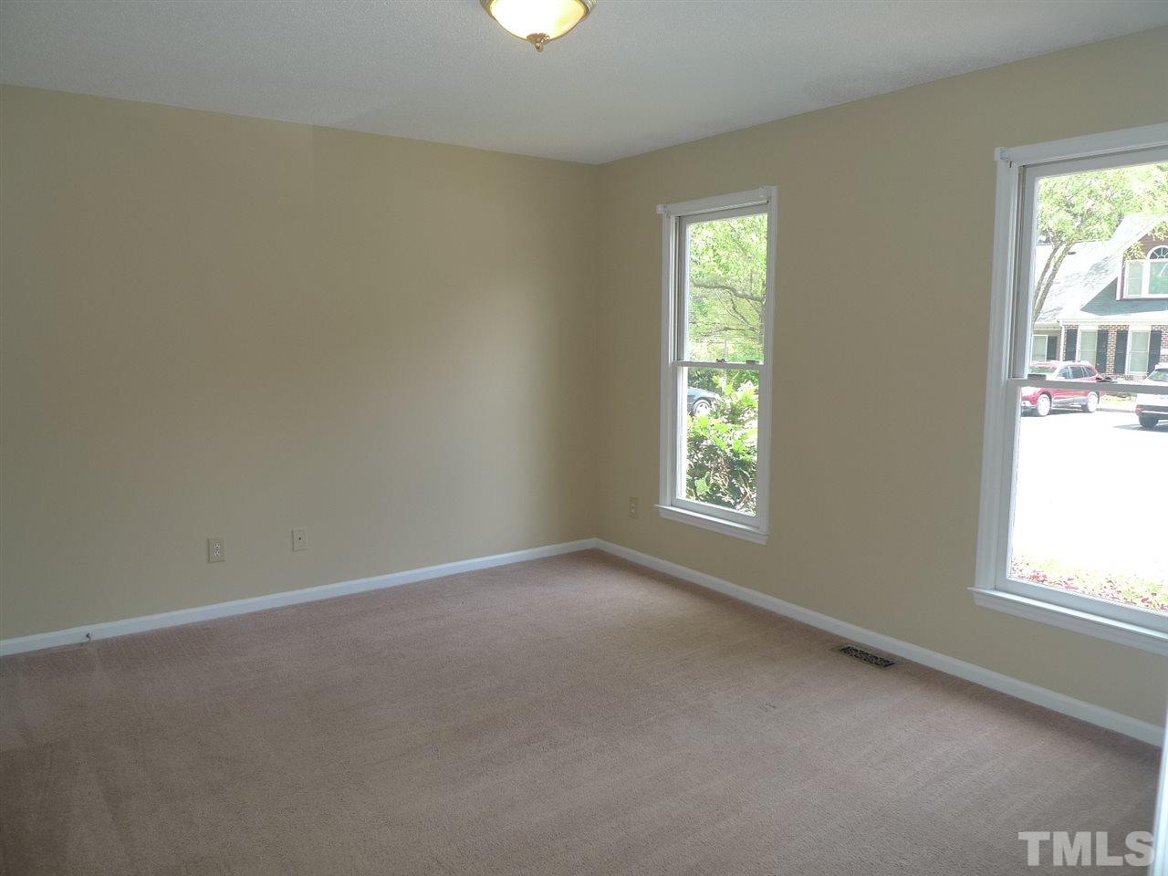 1004 Oak Lake Court Raleigh, NC 27606 - Photo 7 of 9 an empty room with windows