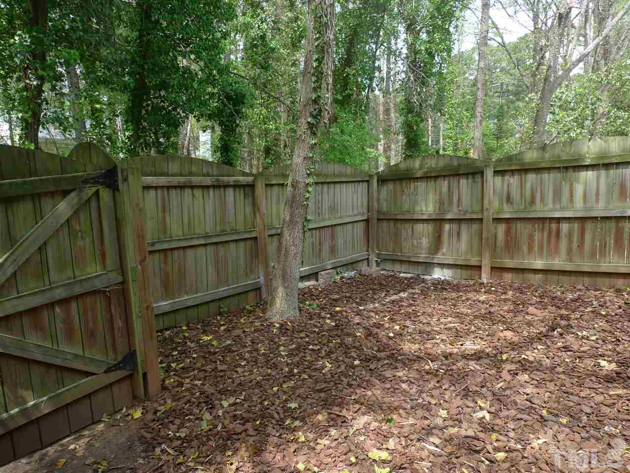 1004 Oak Lake Court Raleigh, NC 27606 - Photo 9 of 9 a backyard of a house with lots of green space