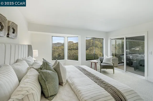 a bedroom with a large bed and a couch