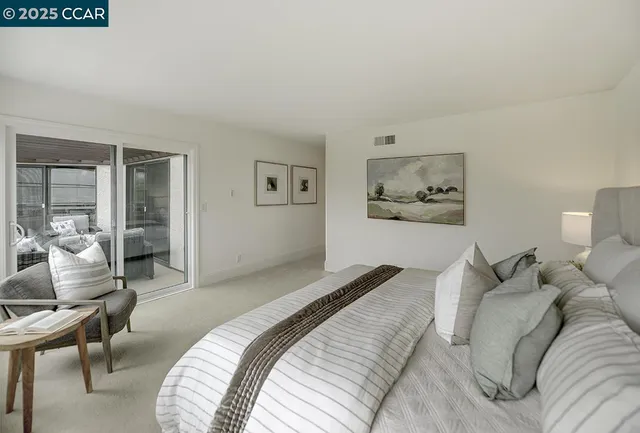 a bedroom with a bed and a view of bathroom