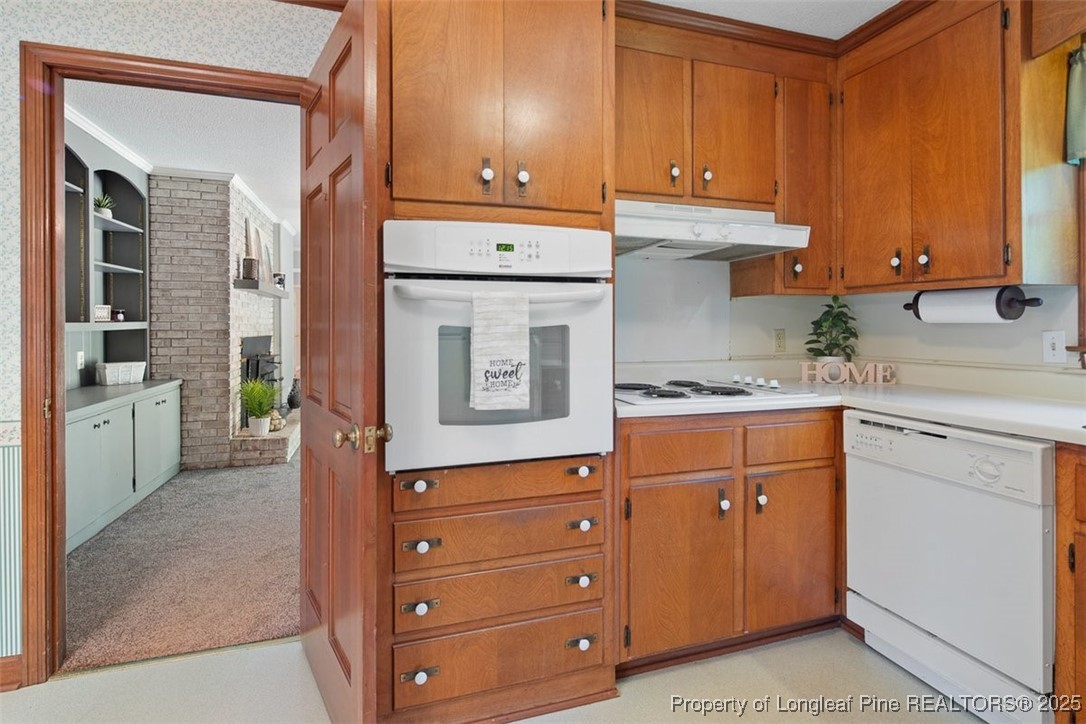 2434 North Bragg Boulevard Spring Lake, NC 28390 - Photo 12 of 44 a kitchen with granite countertop cabinets and window