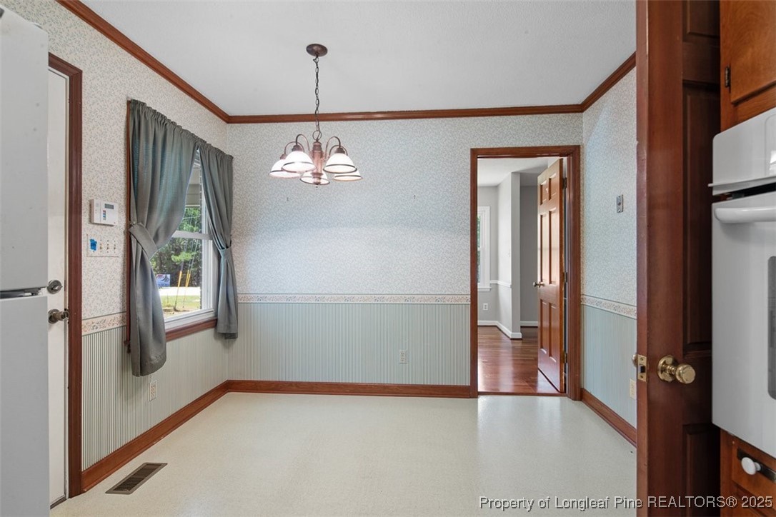 2434 North Bragg Boulevard Spring Lake, NC 28390 - Photo 16 of 44 a view of an entryway with wooden floor