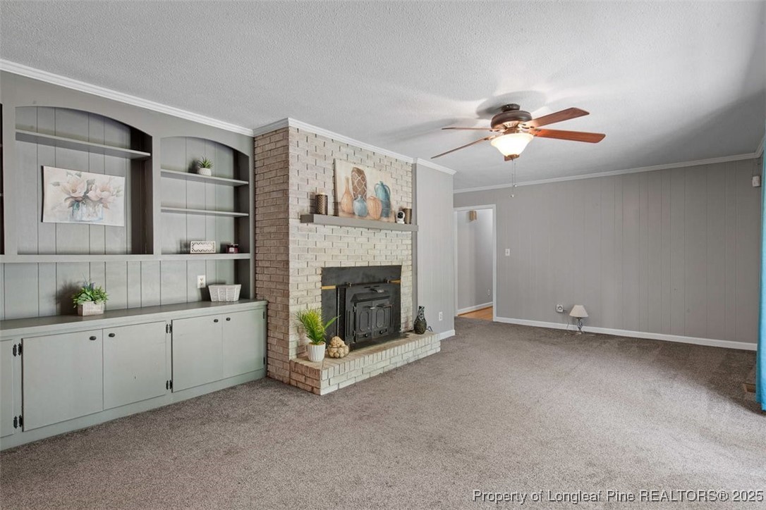 2434 North Bragg Boulevard Spring Lake, NC 28390 - Photo 18 of 44 a living room with furniture and a fireplace