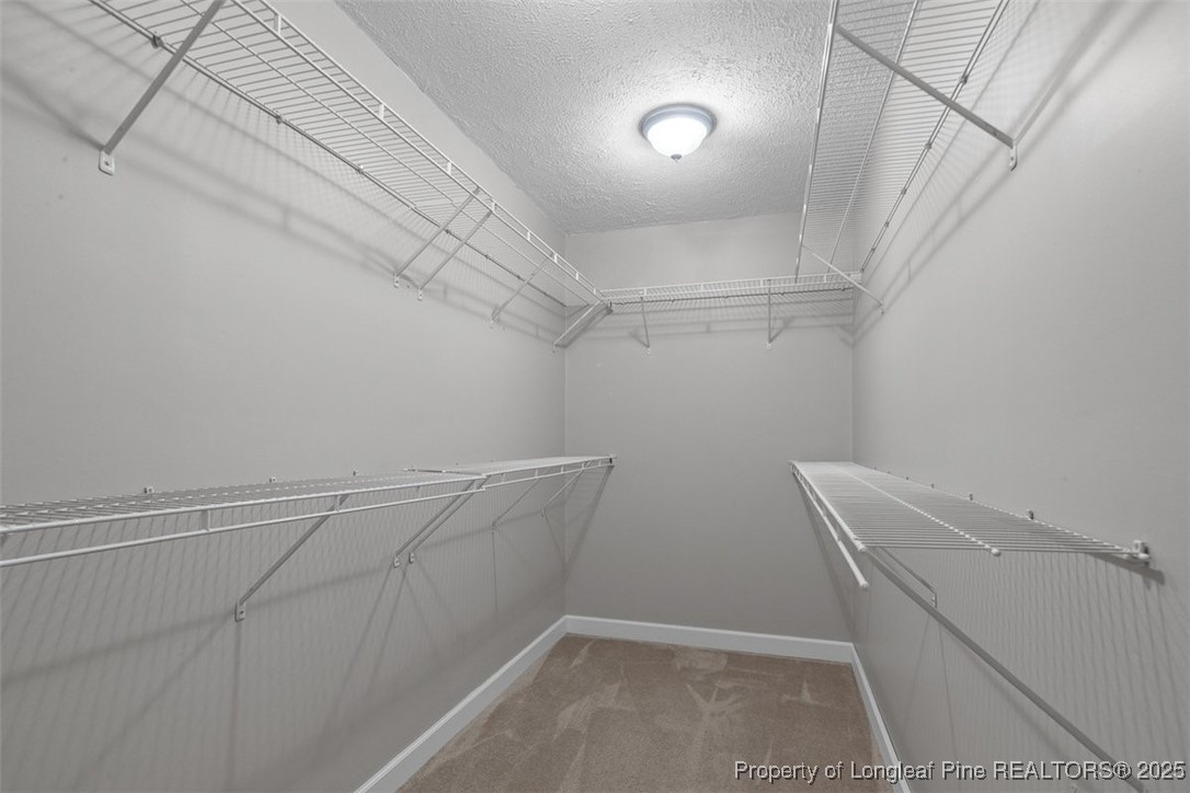 2434 North Bragg Boulevard Spring Lake, NC 28390 - Photo 25 of 44 a view of storage and utility room with racks on the wall