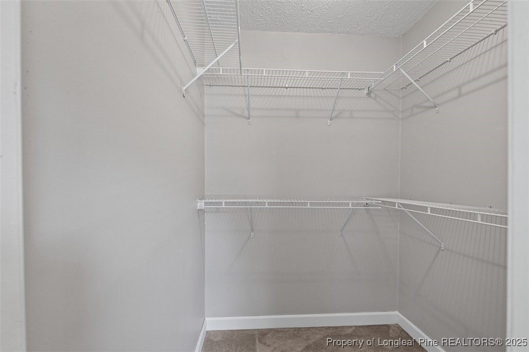 2434 North Bragg Boulevard Spring Lake, NC 28390 - Photo 30 of 44 a view of a room with racks on the wall