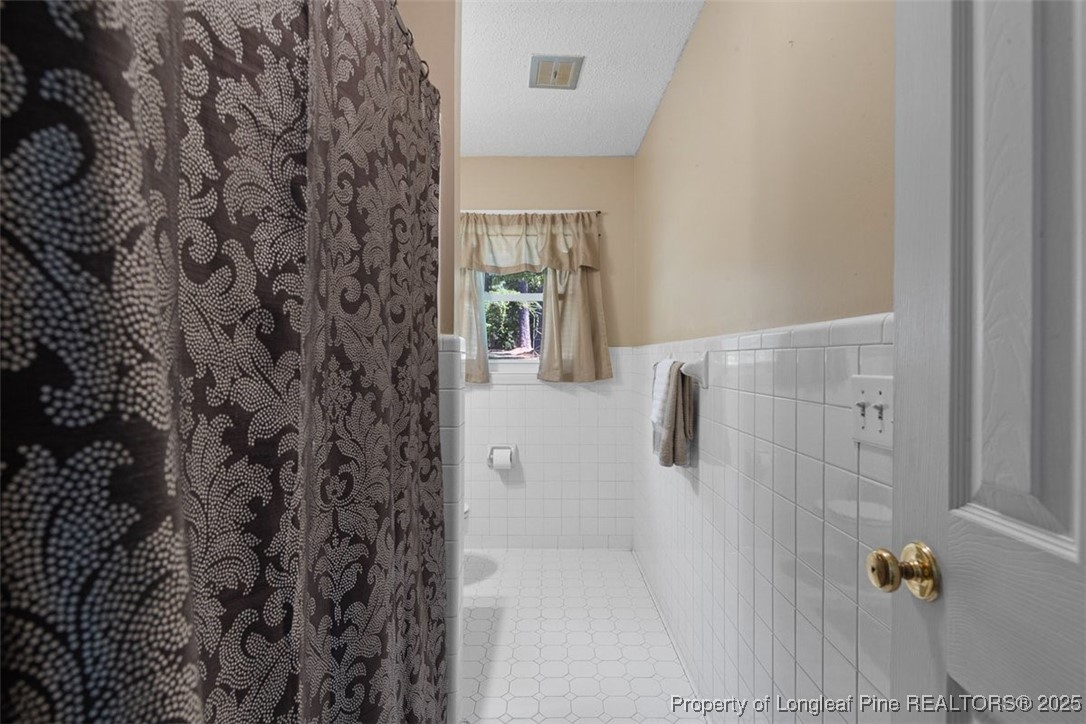 2434 North Bragg Boulevard Spring Lake, NC 28390 - Photo 34 of 44 a bathroom with a shower