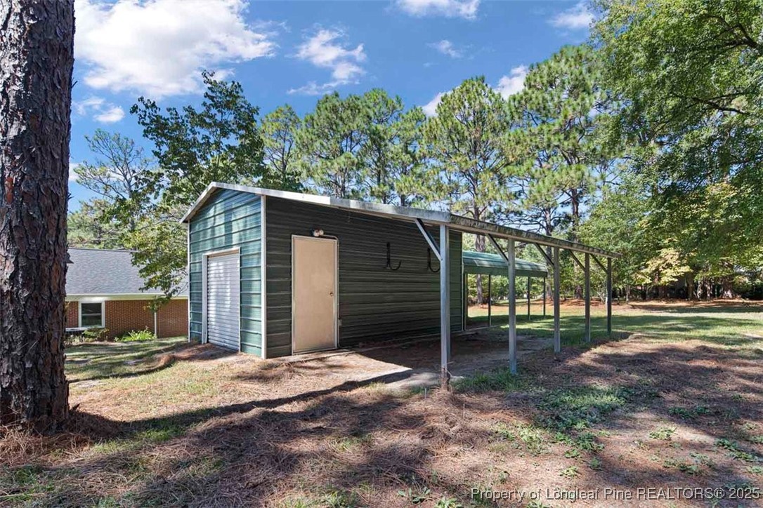 2434 North Bragg Boulevard Spring Lake, NC 28390 - Photo 37 of 44 a backyard of a house with lots of green space