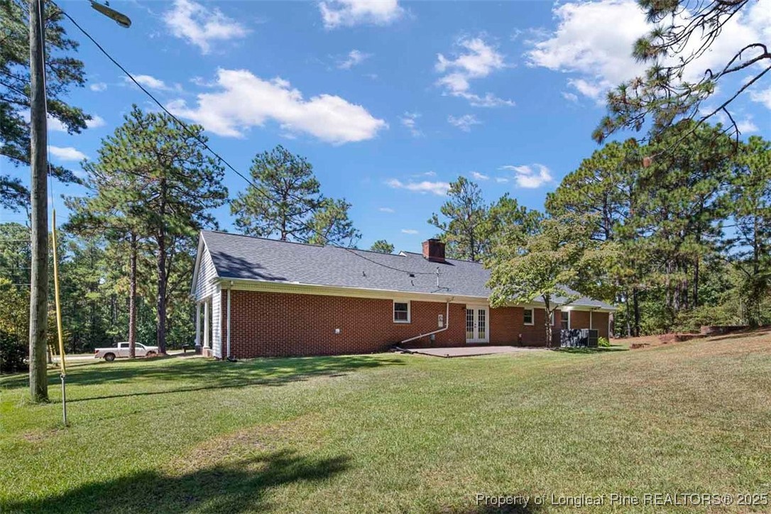 2434 North Bragg Boulevard Spring Lake, NC 28390 - Photo 39 of 44 a front view of a house with a garden