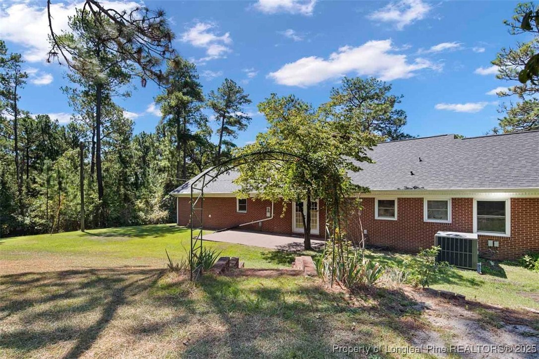 2434 North Bragg Boulevard Spring Lake, NC 28390 - Photo 41 of 44 a view of a house with backyard and a tree